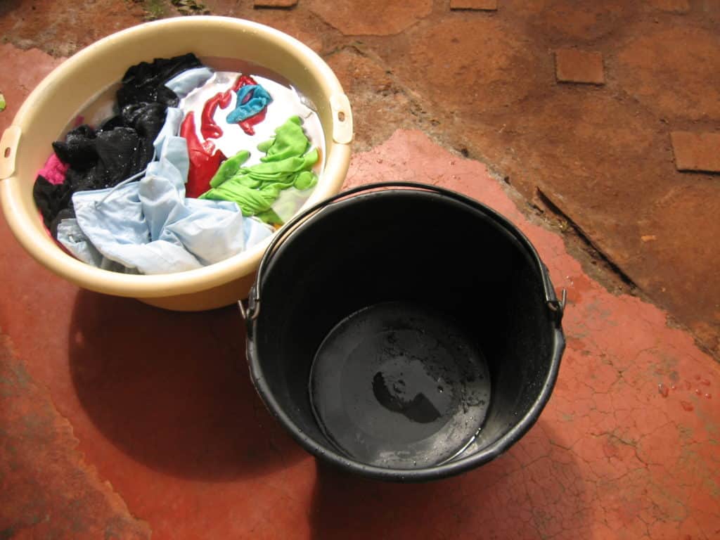 Doing laundry in buckets in Cameroon