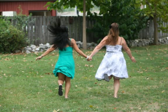 friends running through field